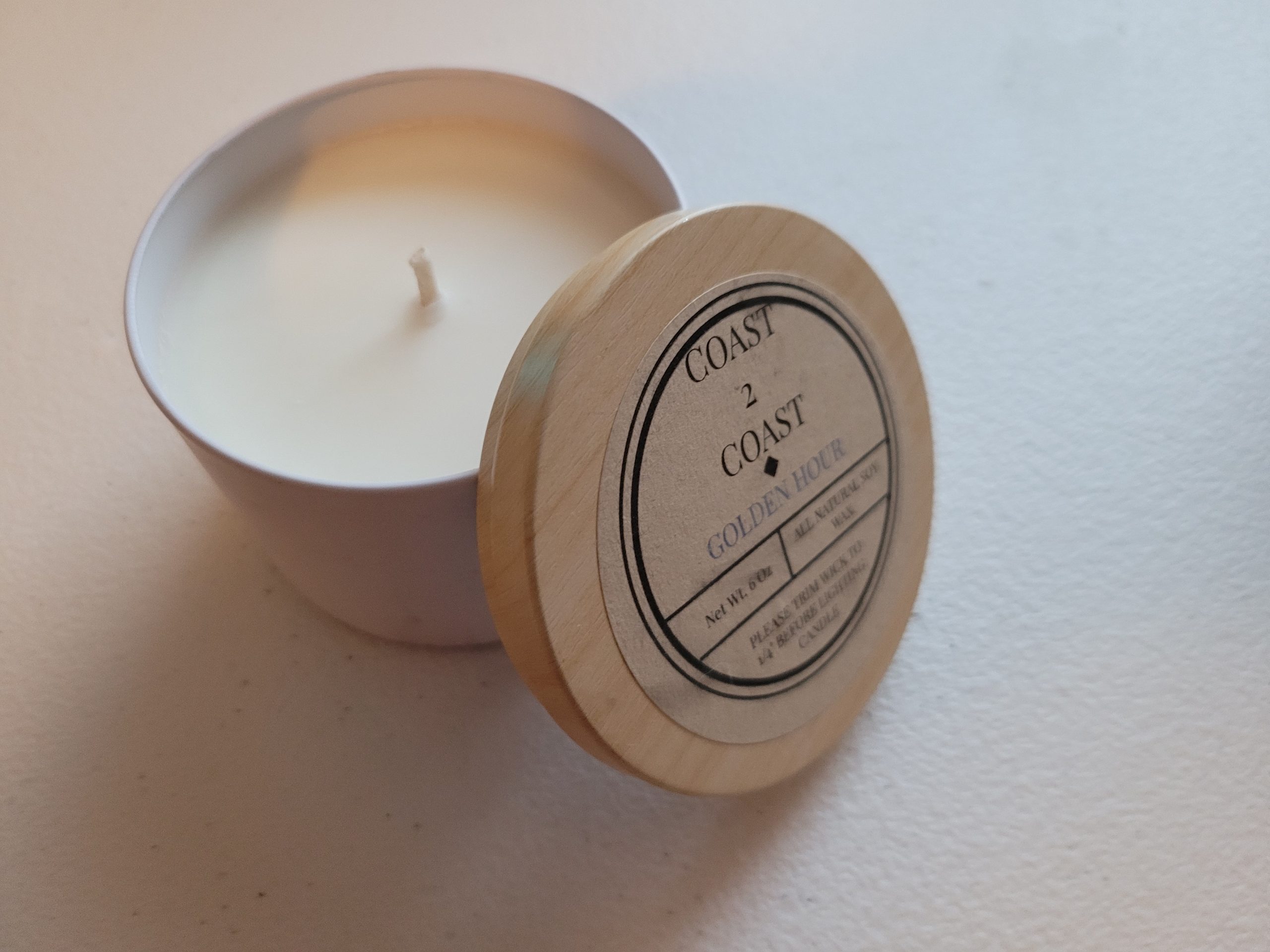 6.5oz white metal candle with sea glass surprise